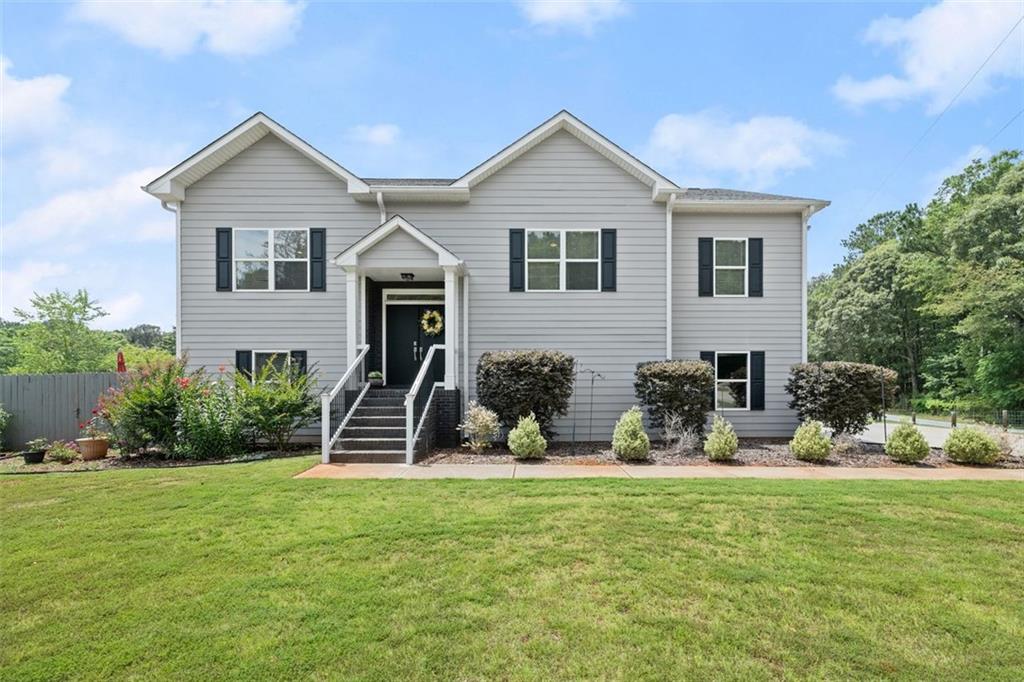 724 Murphy Road Winder, GA 30680 - Photo 1 of 1 a front view of a house with a yard