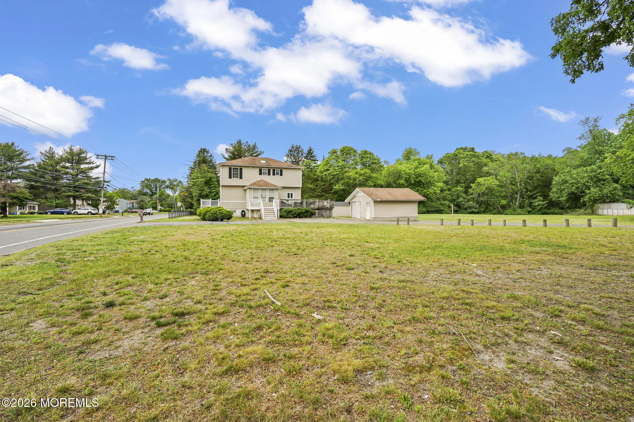 438 Bennetts Mills Road Jackson, NJ 08527 - Photo 27 of 42 a large body of water with a building in the background