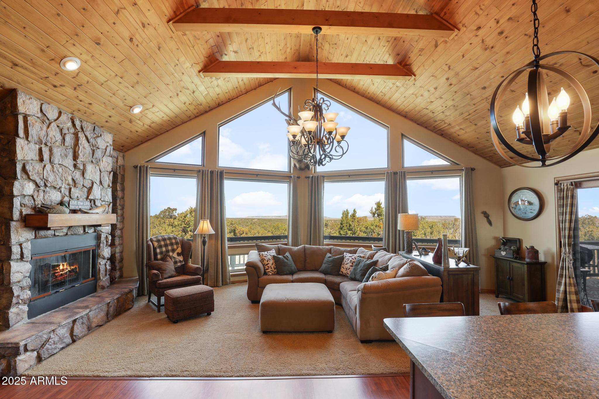 4018 Sunset Rdg Loop Happy Jack, AZ 86024 - Photo 15 of 46 a living room with furniture and a fireplace