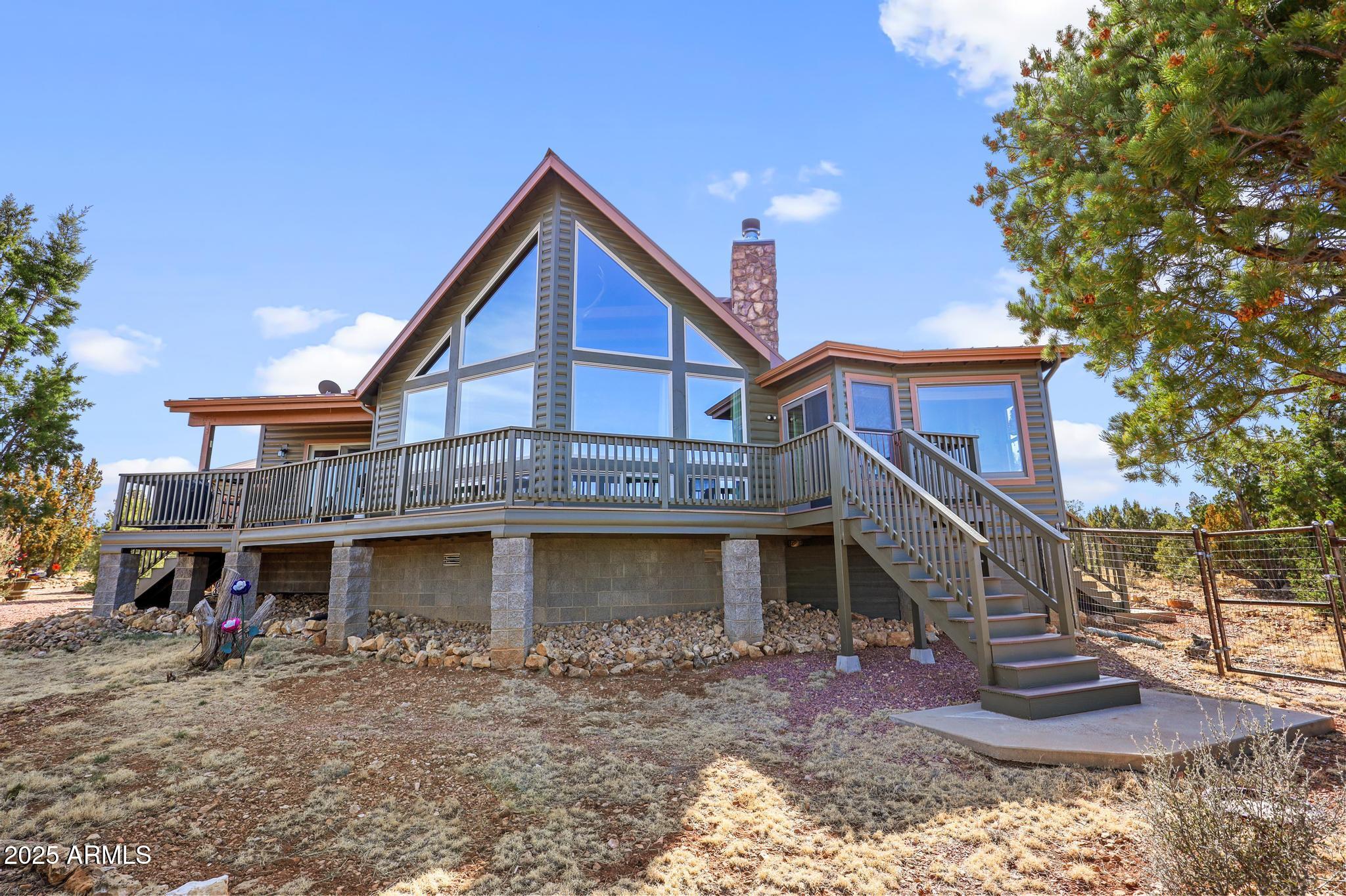 4018 Sunset Rdg Loop Happy Jack, AZ 86024 - Photo 2 of 46 a view of a house with a yard
