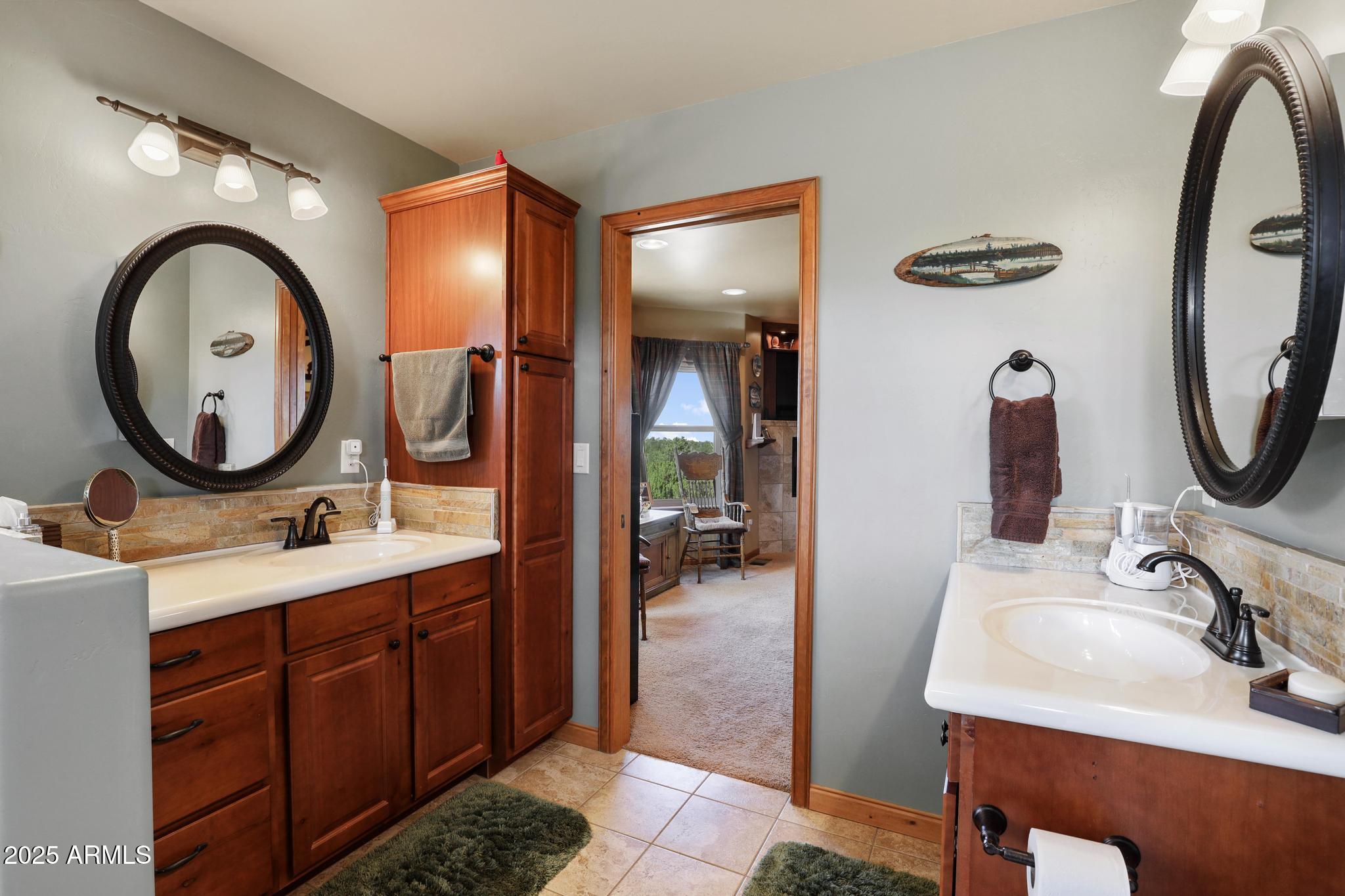 4018 Sunset Rdg Loop Happy Jack, AZ 86024 - Photo 22 of 46 a bathroom with a sink and a mirror