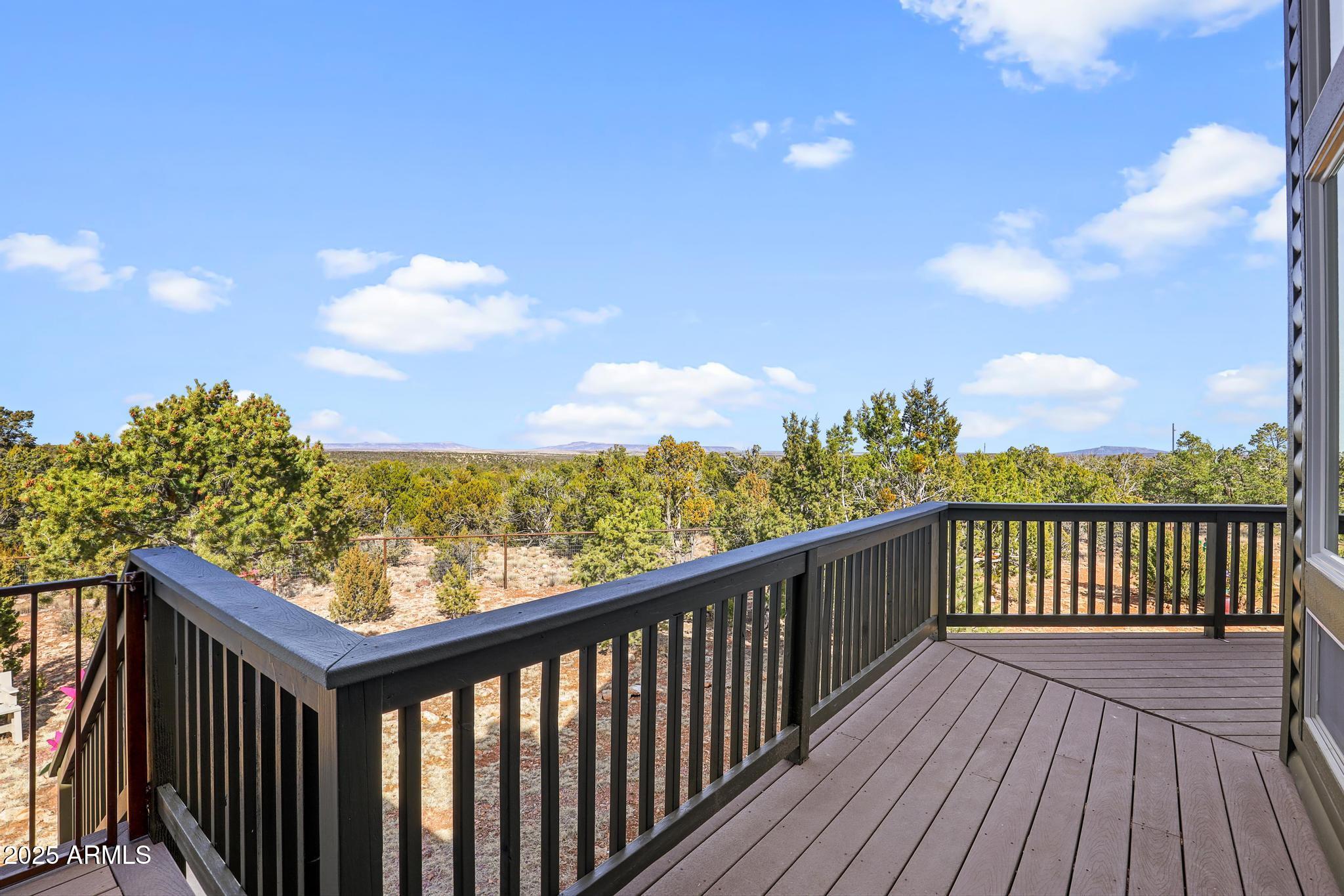 4018 Sunset Rdg Loop Happy Jack, AZ 86024 - Photo 28 of 46 a view of a balcony with wooden floor