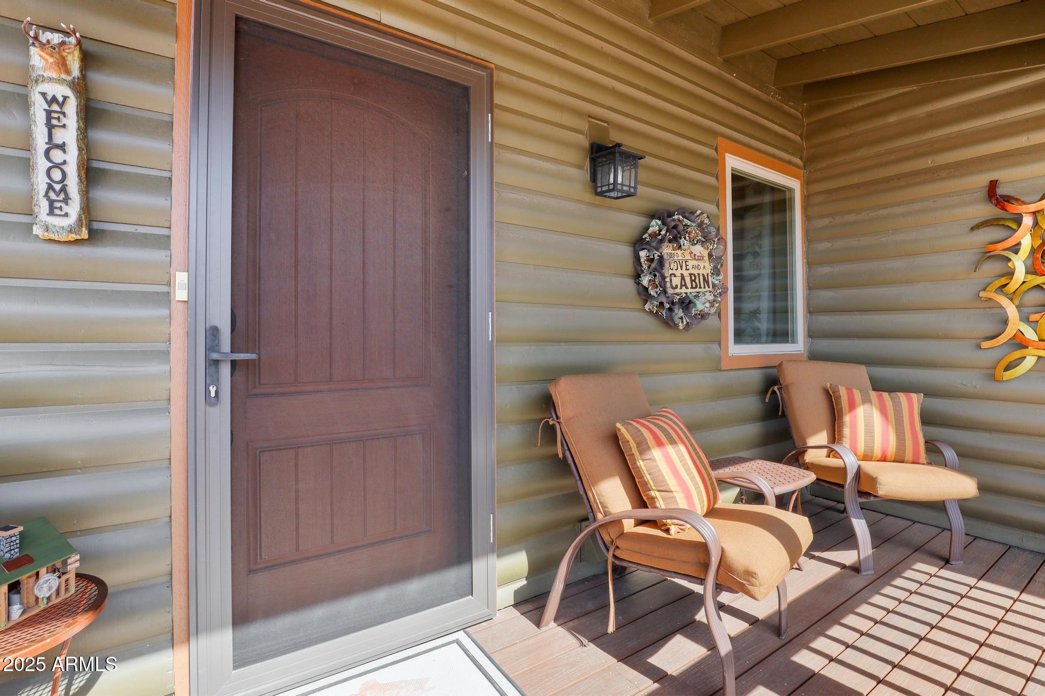 4018 Sunset Rdg Loop Happy Jack, AZ 86024 - Photo 3 of 46 a couple of chairs sitting in front of a door