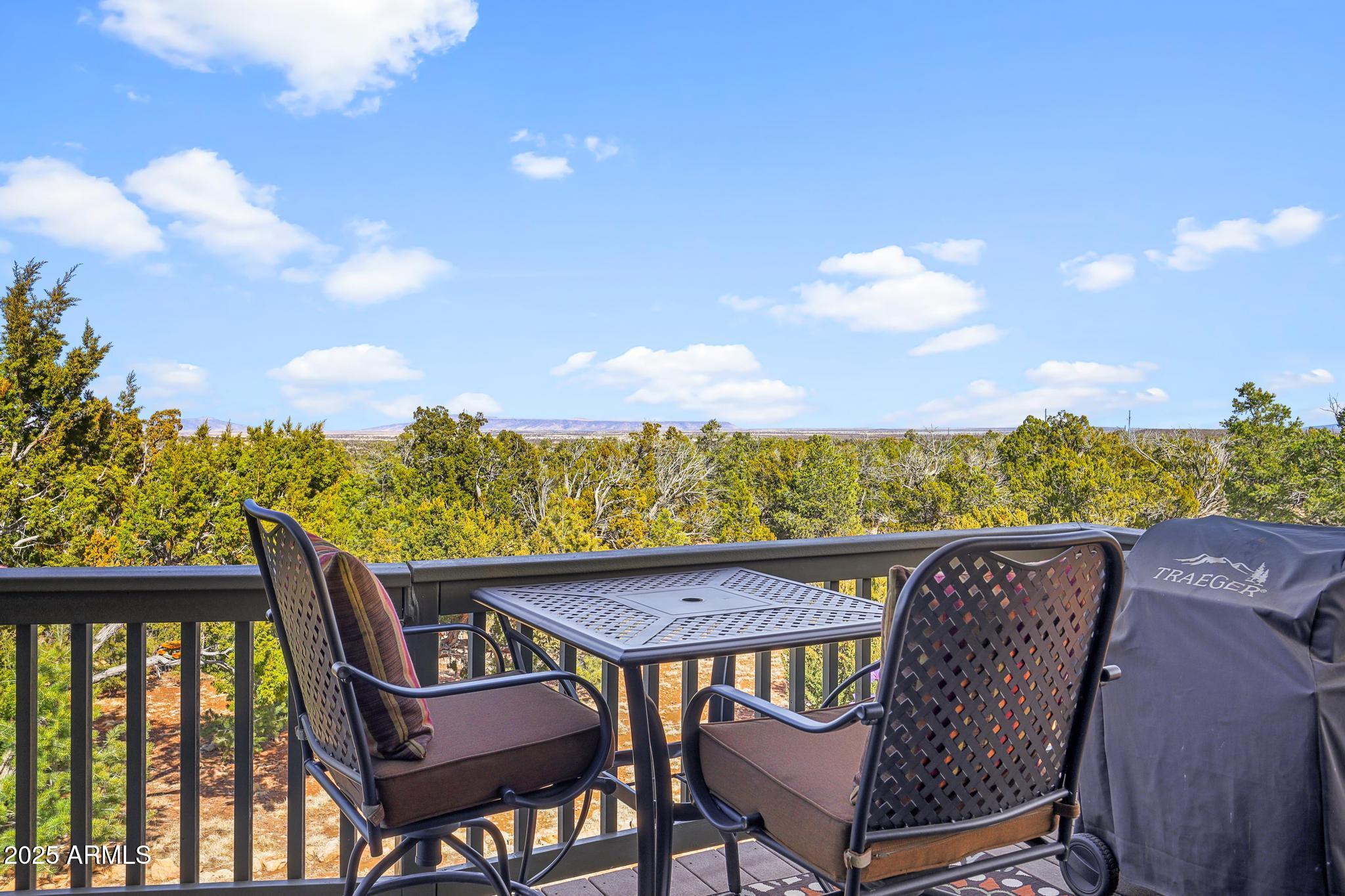 4018 Sunset Rdg Loop Happy Jack, AZ 86024 - Photo 31 of 46 a view of a chairs and table in patio