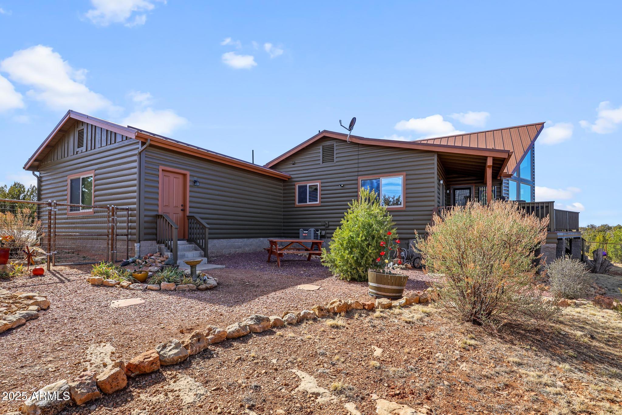 4018 Sunset Rdg Loop Happy Jack, AZ 86024 - Photo 33 of 46 a front view of house with yard and seating space