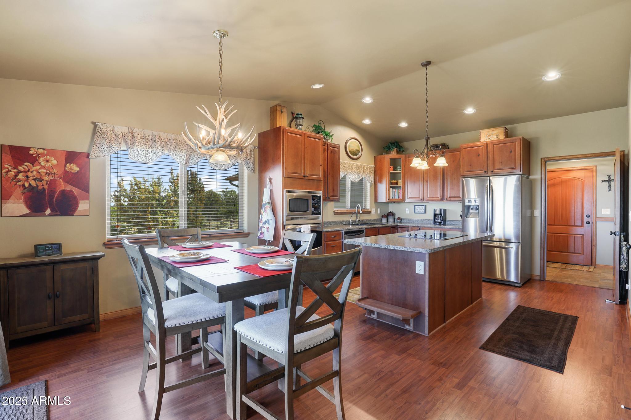 4018 Sunset Rdg Loop Happy Jack, AZ 86024 - Photo 4 of 46 a dining table & chairs in a kitchen
