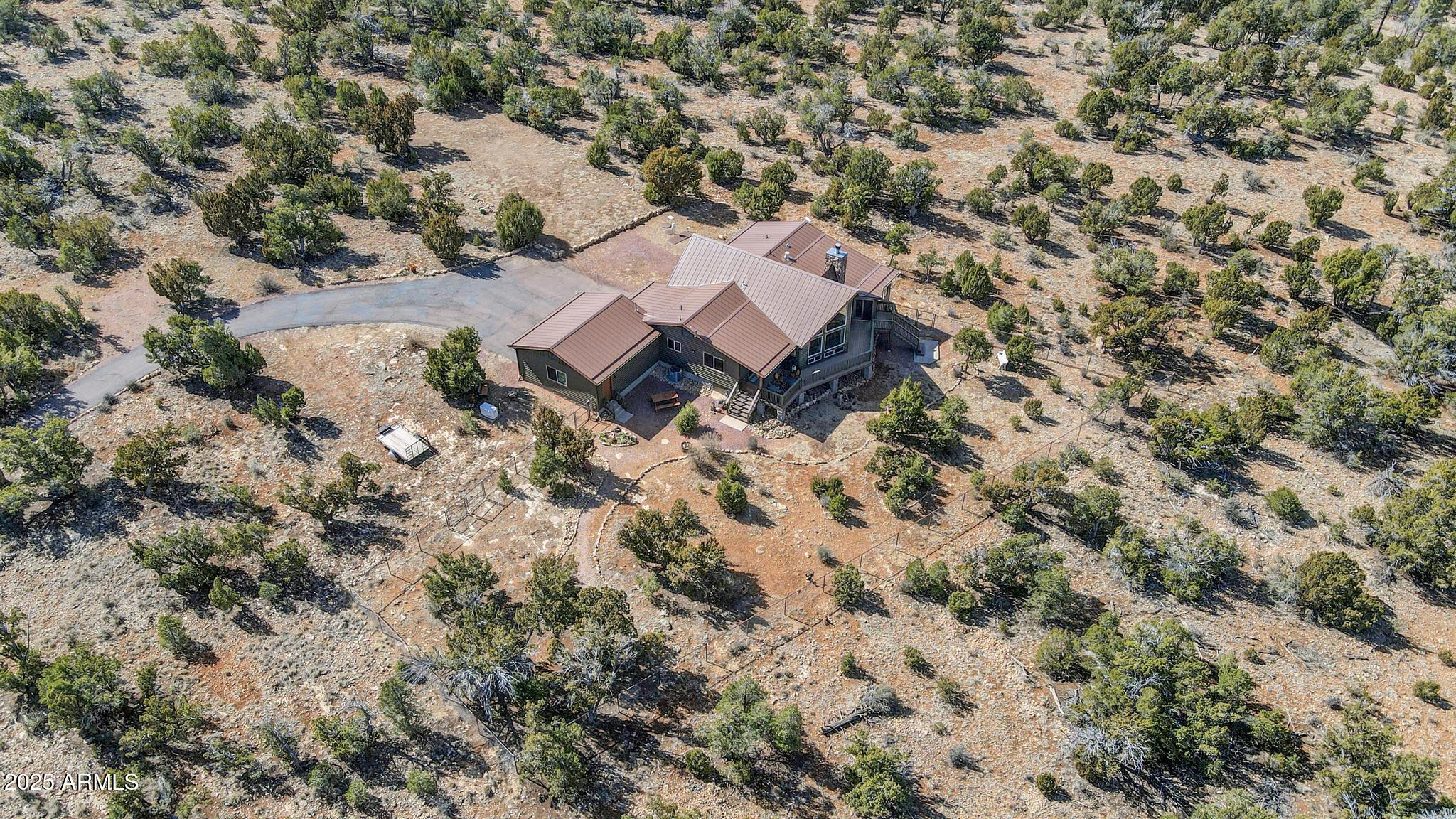 4018 Sunset Rdg Loop Happy Jack, AZ 86024 - Photo 41 of 46 an aerial view of house with yard and mountain view in back