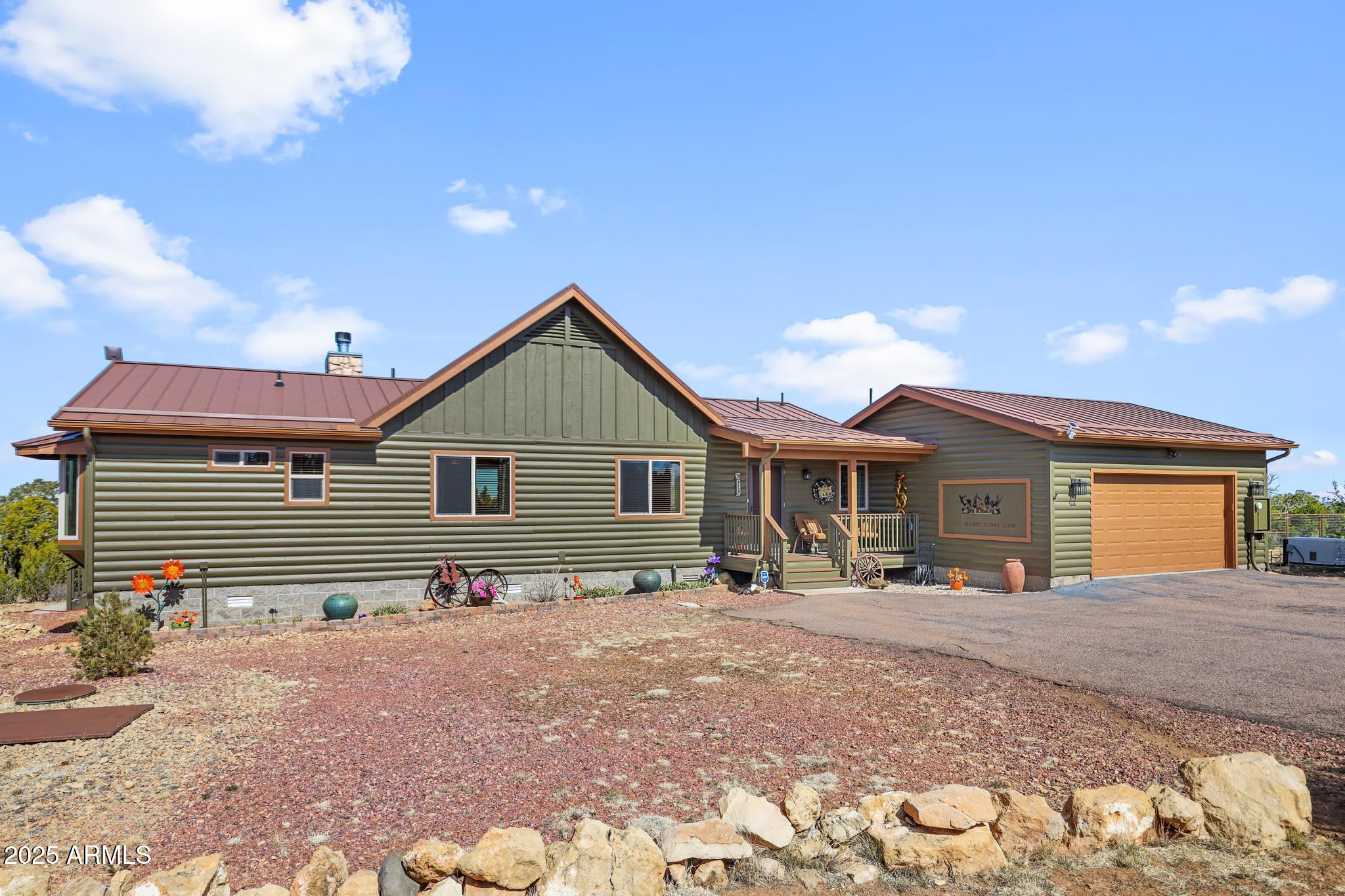 4018 Sunset Rdg Loop Happy Jack, AZ 86024 - Photo 44 of 46 a front view of a house with yard