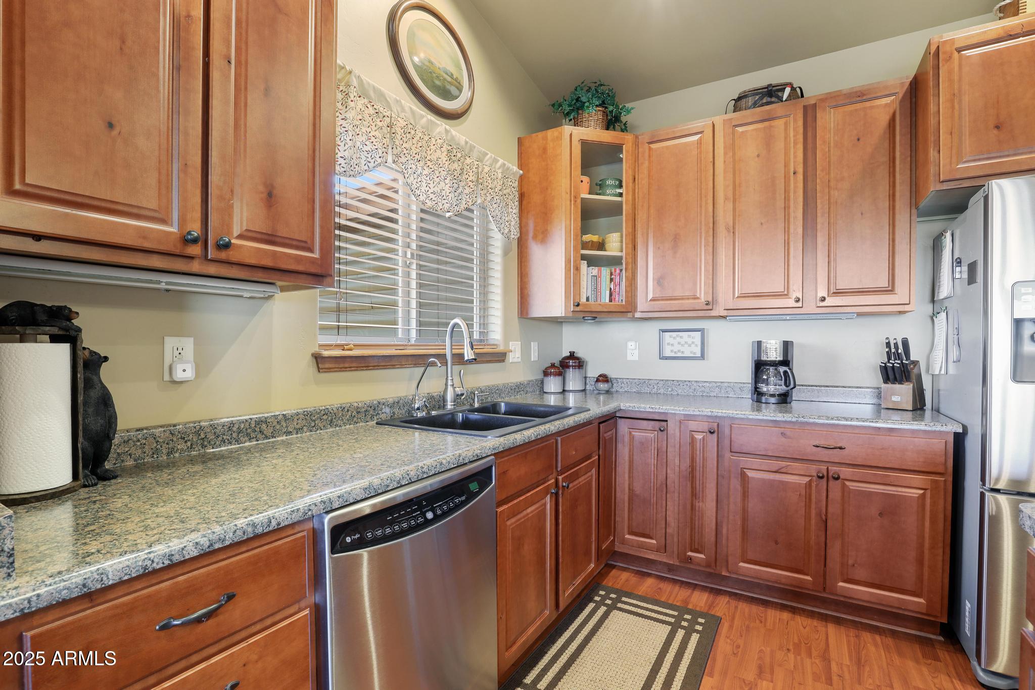4018 Sunset Rdg Loop Happy Jack, AZ 86024 - Photo 9 of 46 a kitchen with stainless steel appliances granite countertop a sink and cabinets