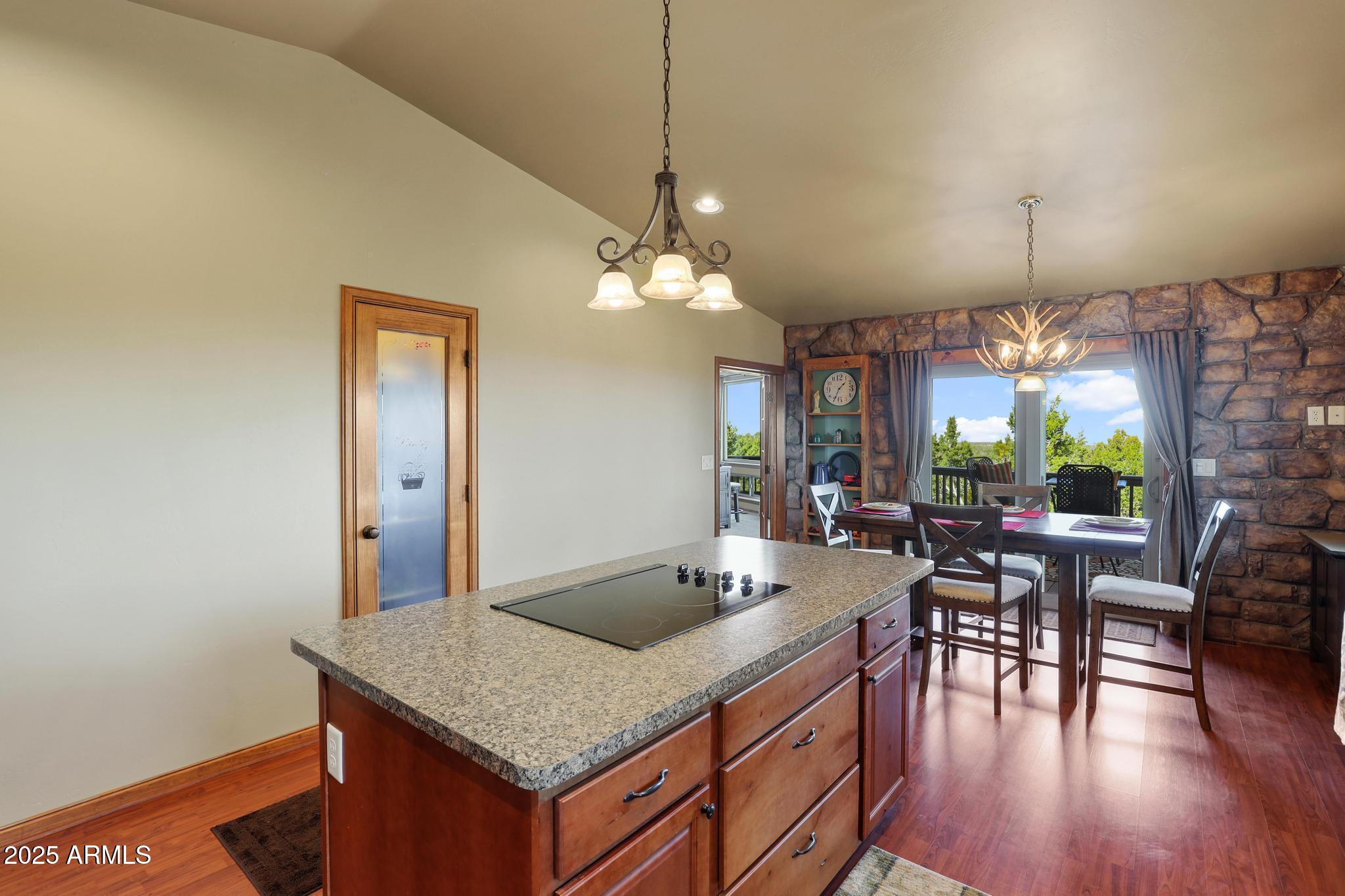 4018 Sunset Rdg Loop Happy Jack, AZ 86024 - Photo 10 of 46 a view of a dining room with furniture and wooden floor