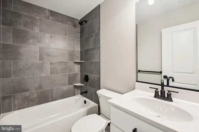 a bathroom with a bathtub and a sink