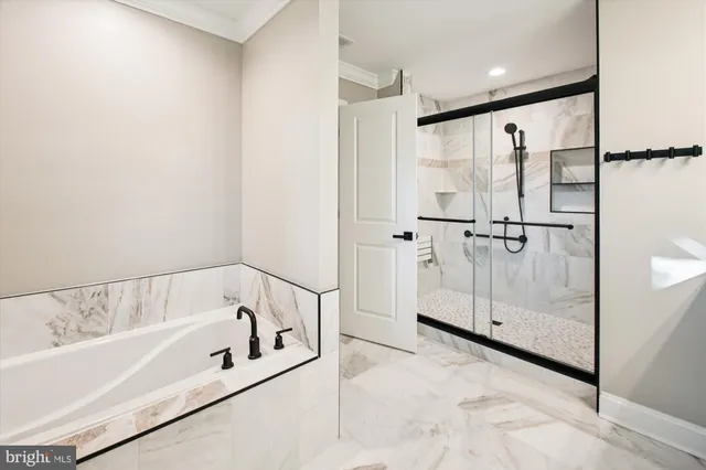 a bathroom with a bathtub and a shower