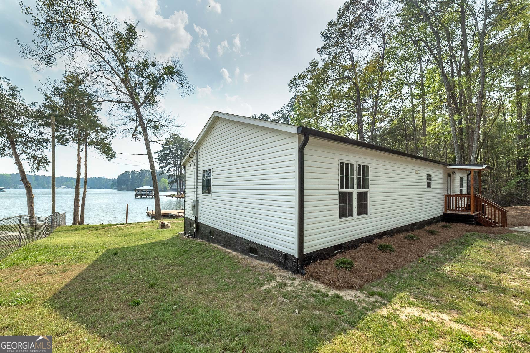 595 Barnetts Bridge Road Jackson, GA 30233 - Photo 42 of 47 a view of a backyard with a small cabin