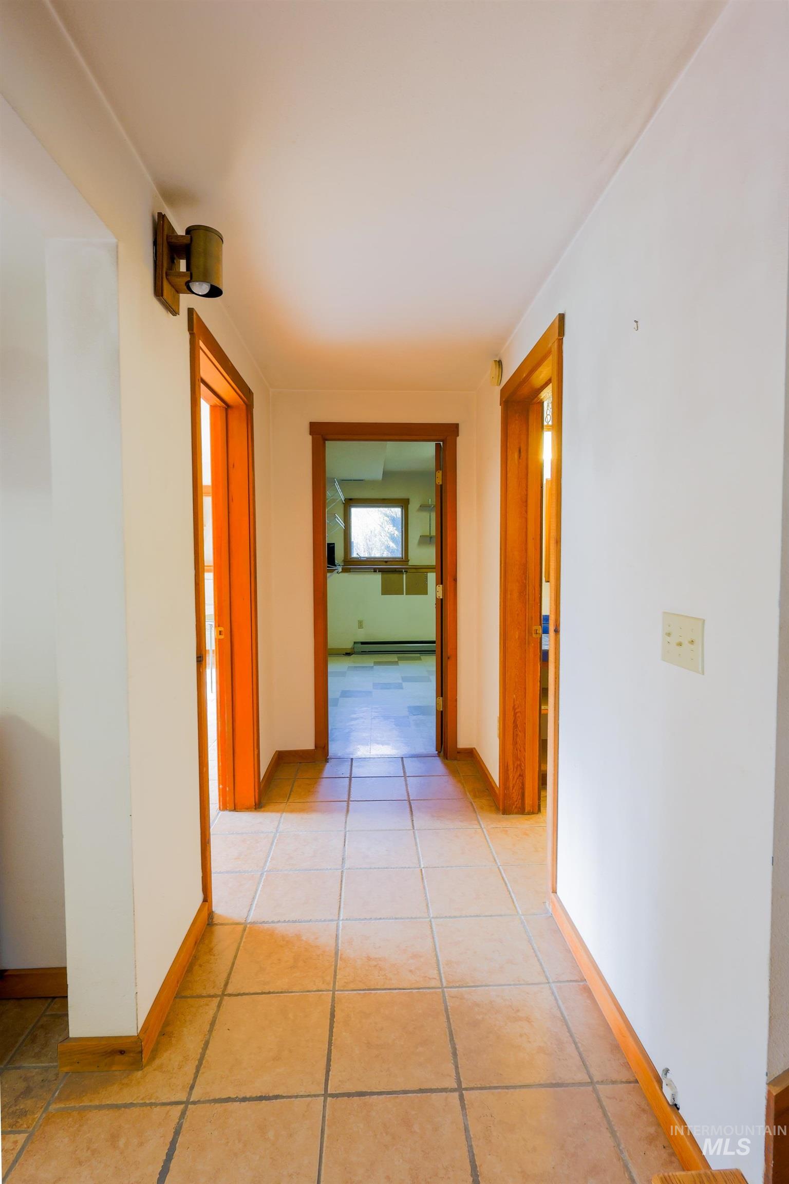 1021 Claypit Road Troy, ID 83871 - Photo 22 of 44 Hall featuring baseboards and light tile patterned floors