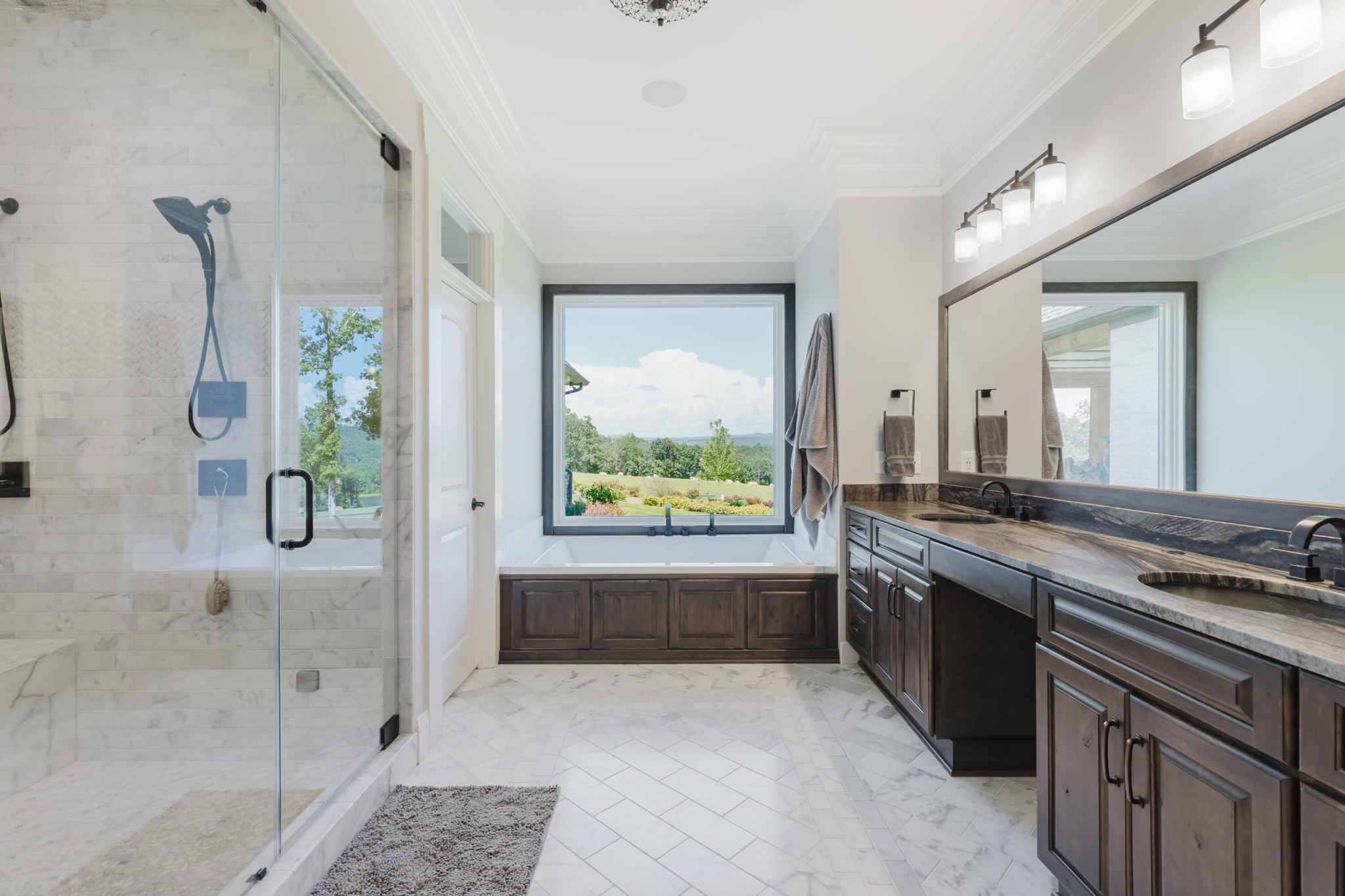 1129 Farmersville Road Summerville, GA 30747 - Photo 62 of 100 a large bathroom with a granite countertop tub a sink and a large mirror