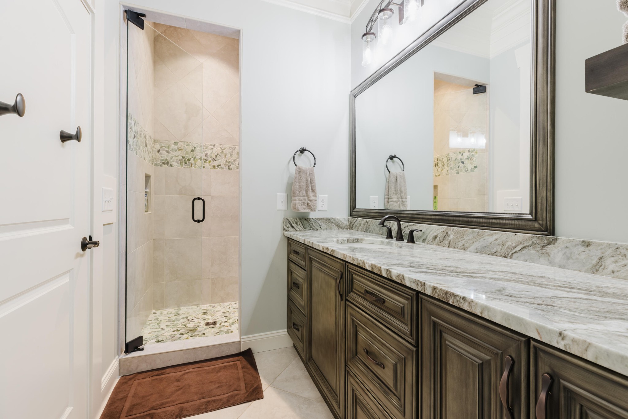 1129 Farmersville Road Summerville, GA 30747 - Photo 73 of 100 a bathroom with a granite countertop sink a mirror and a shower