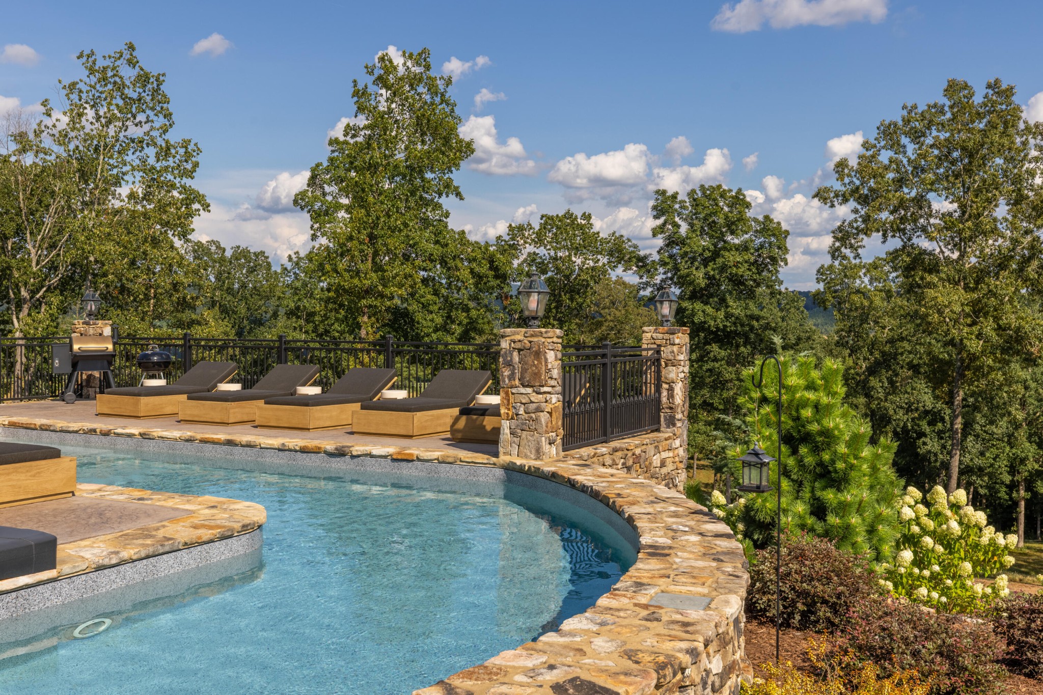 1129 Farmersville Road Summerville, GA 30747 - Photo 81 of 100 a view of a swimming pool with a yard