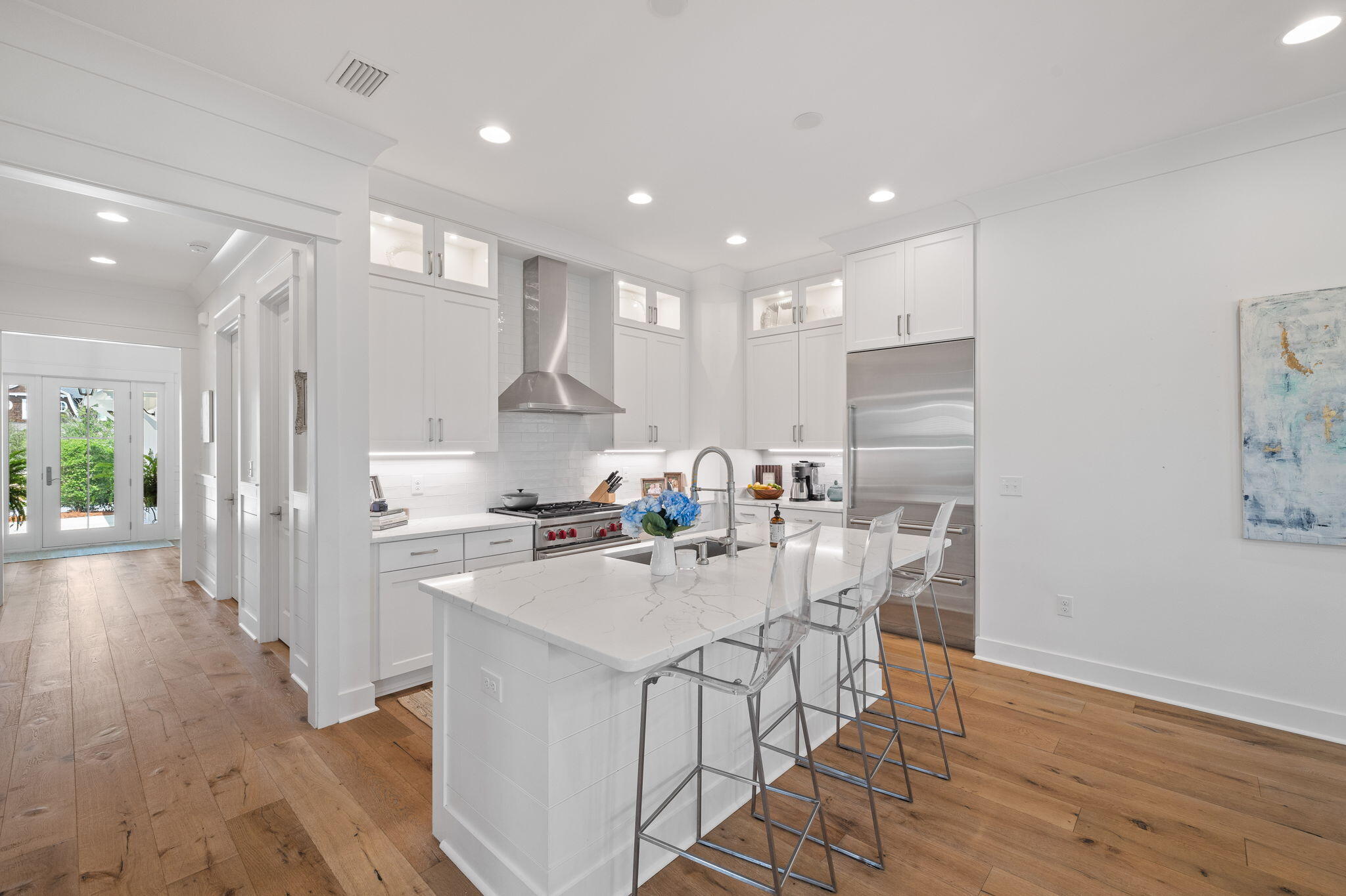 158 Trailhead Drive Inlet Beach, FL 32461 - Photo 9 of 35 a kitchen with a sink a refrigerator and wooden floor