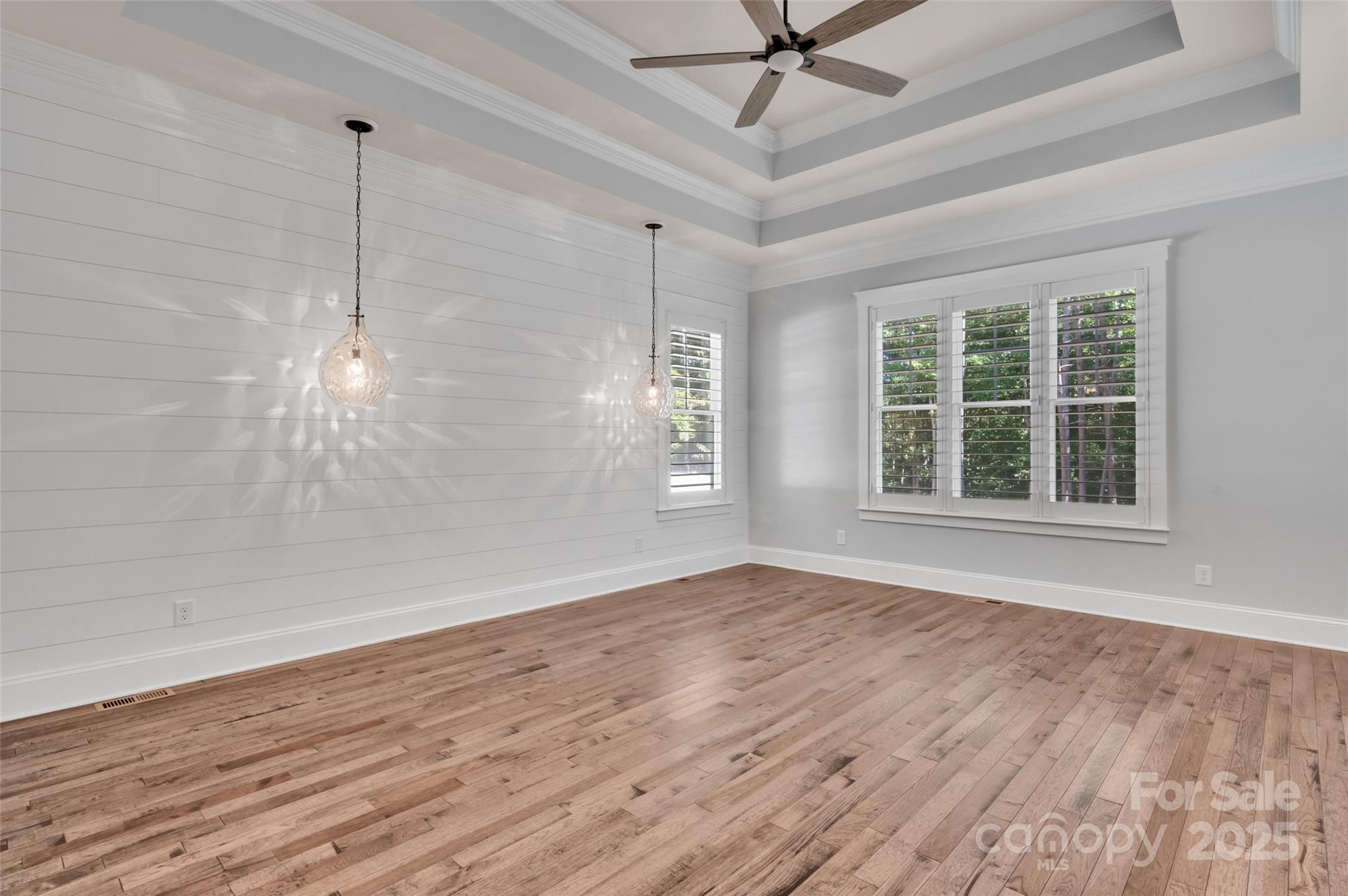1622 Hunters Place Road York, SC 29745 - Photo 15 of 39 a view of a livingroom with wooden floor and a ceiling fan