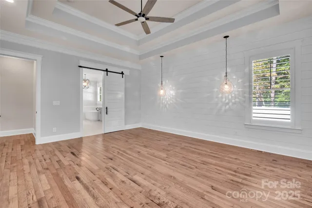 a view of a double vanity sink mirror and window