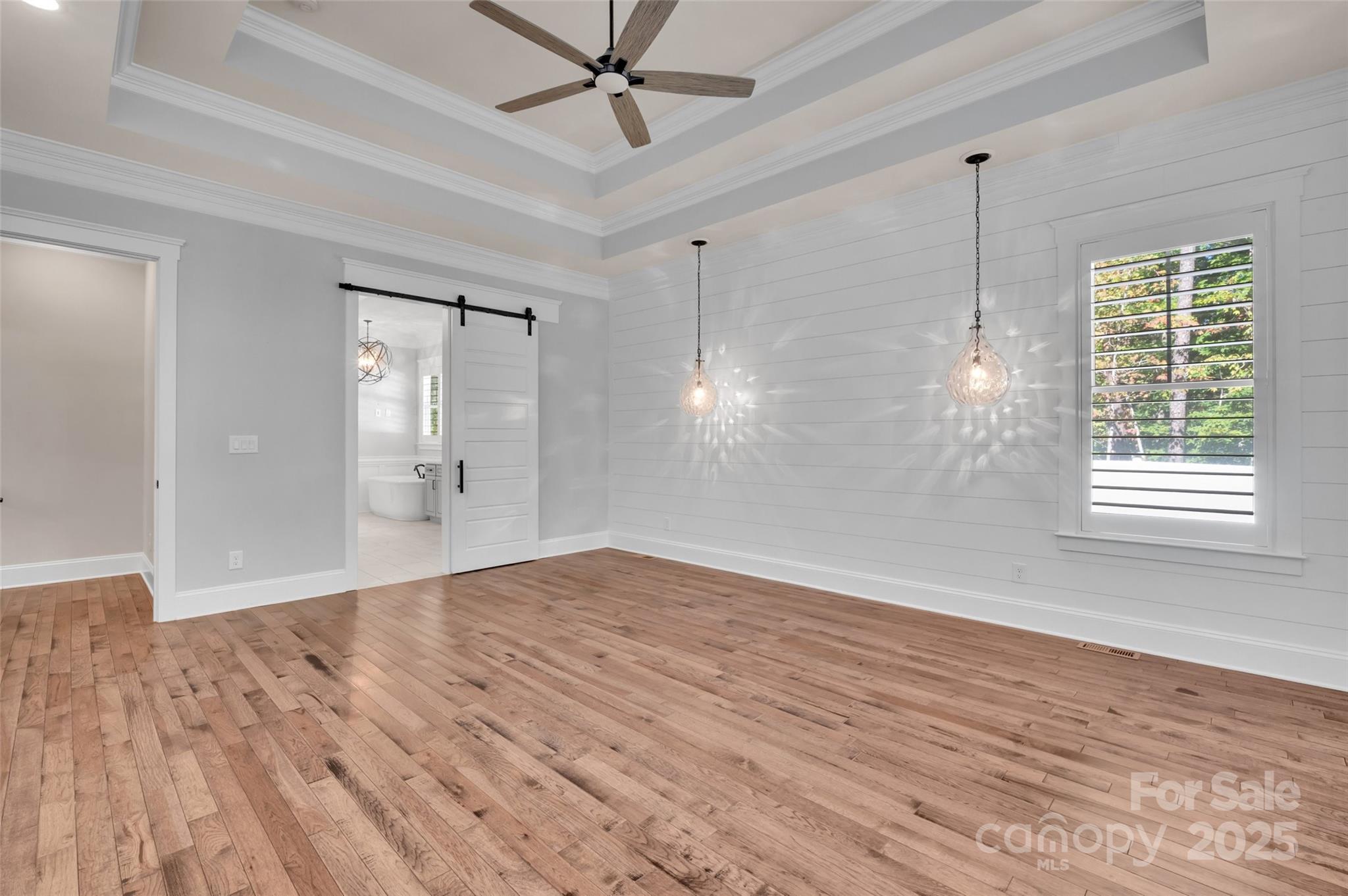 1622 Hunters Place Road York, SC 29745 - Photo 16 of 39 a view of empty room with wooden floor and fan