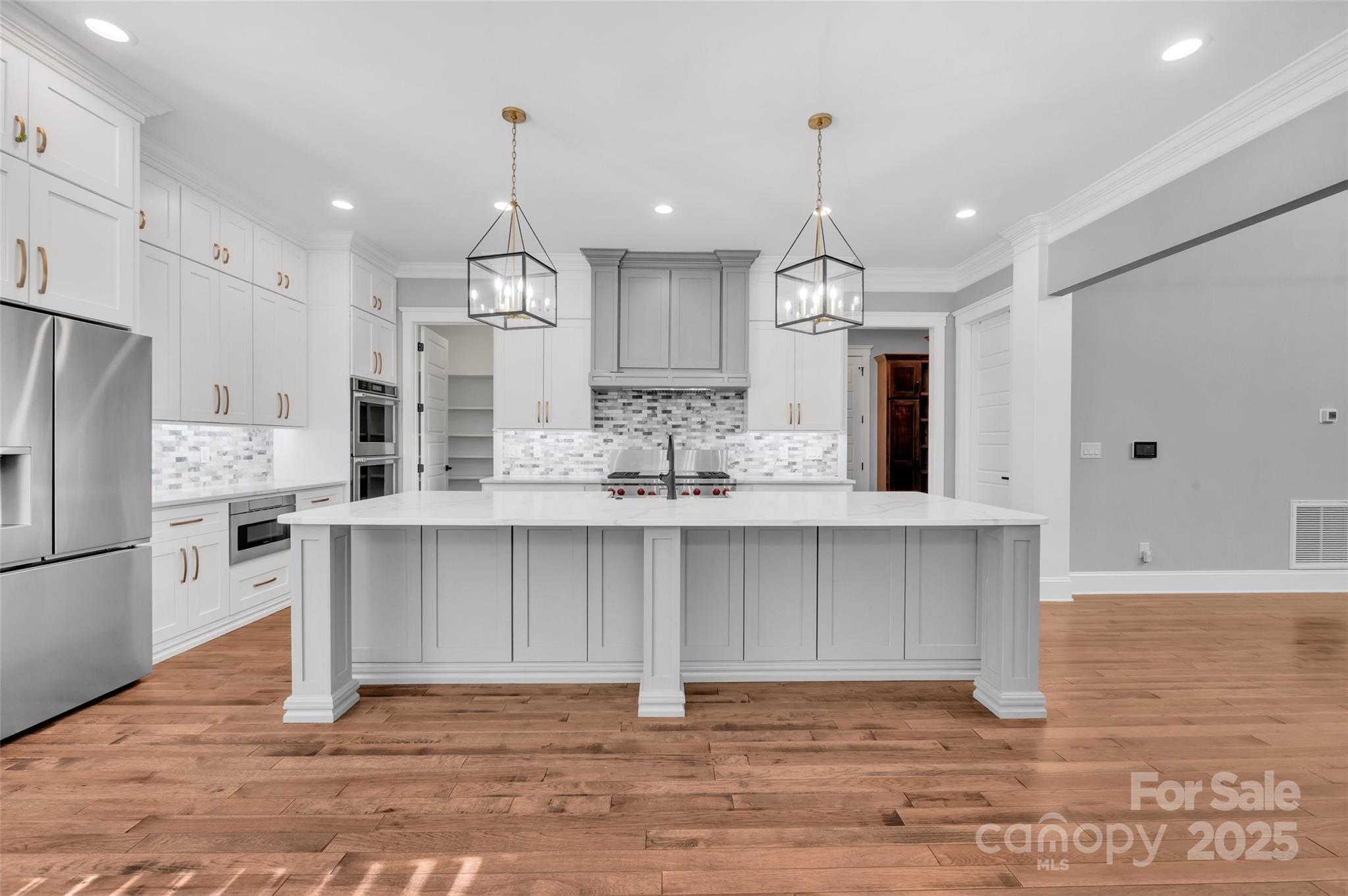 1622 Hunters Place Road York, SC 29745 - Photo 6 of 39 a kitchen with granite countertop a stove a refrigerator and a fireplace