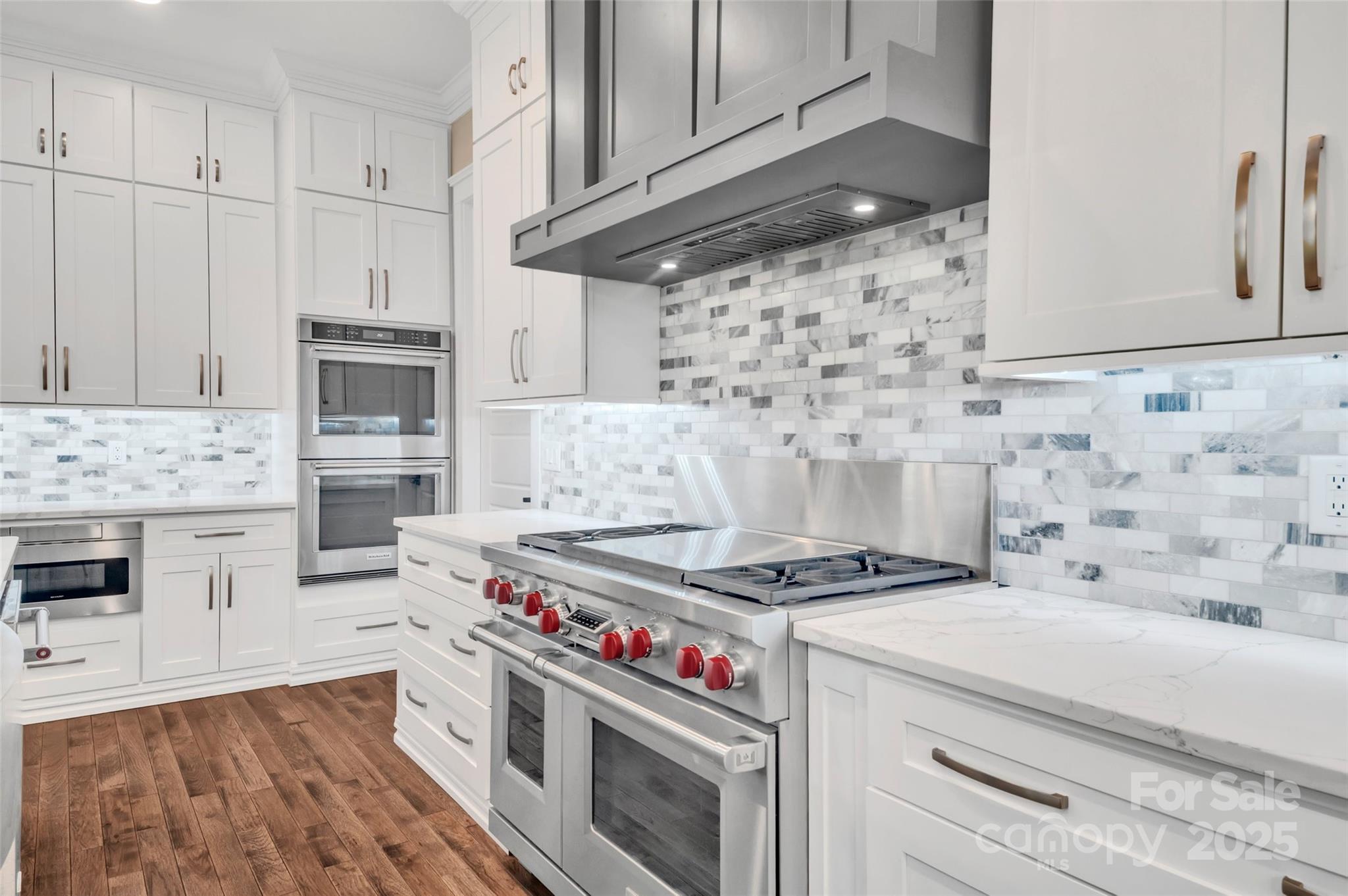1622 Hunters Place Road York, SC 29745 - Photo 8 of 39 a kitchen with granite countertop a stove and a wooden floor