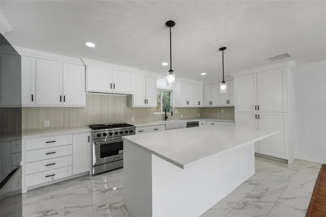 a large kitchen with cabinets