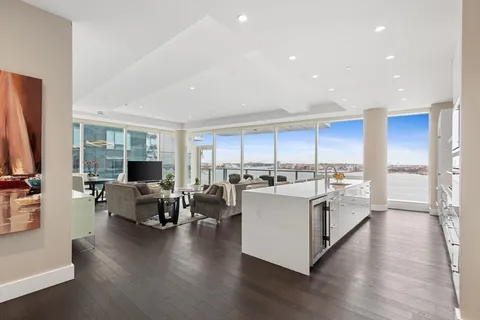 a room with gym equipment and large mirror