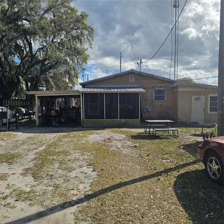 a view of a house that has a yard