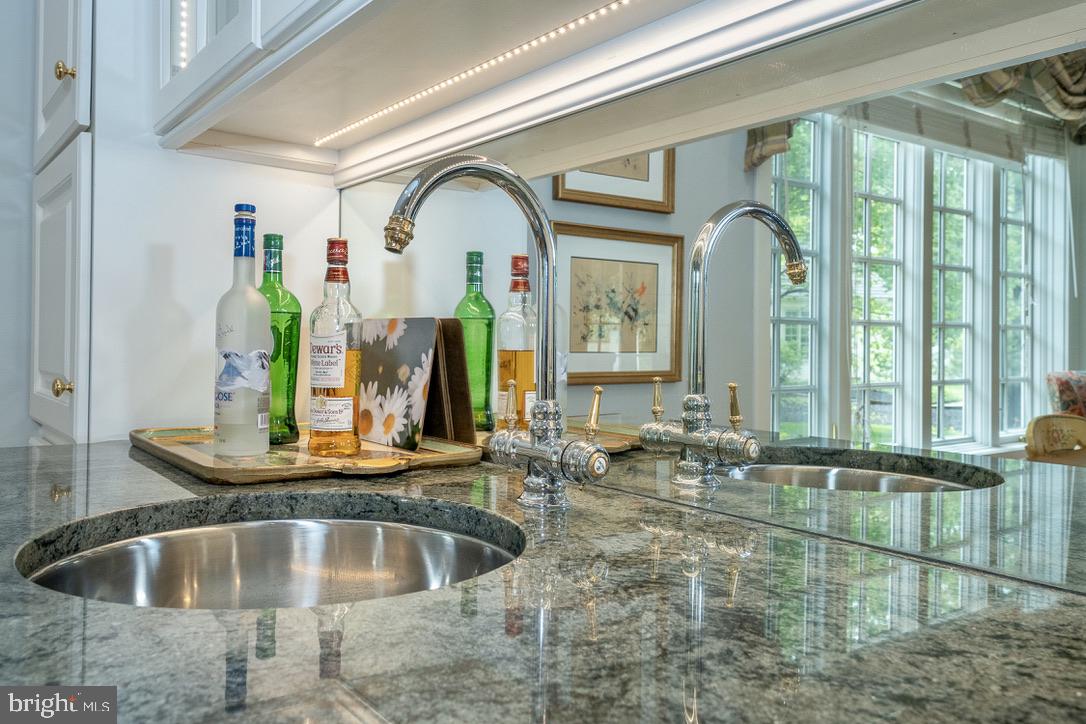 1201 Denbigh Lane Wayne, PA 19087 - Photo 16 of 54 a kitchen with granite countertop a sink and natural light