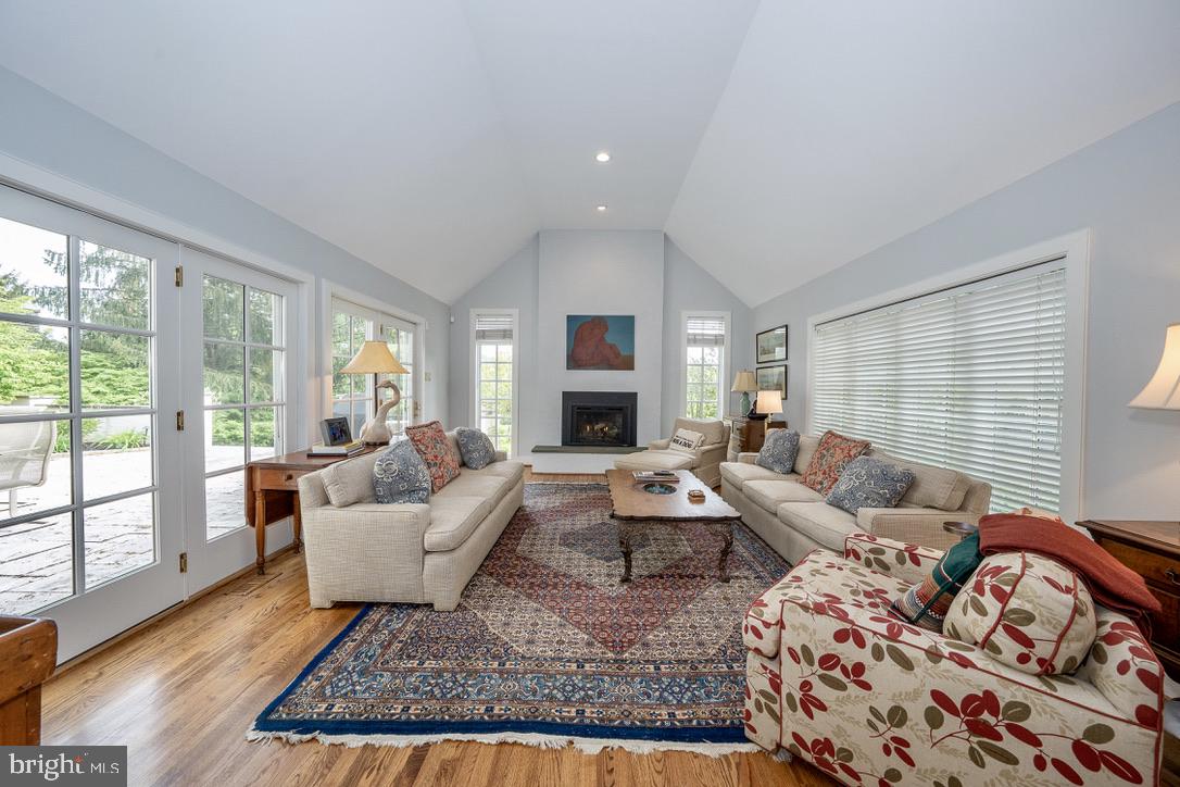 1201 Denbigh Lane Wayne, PA 19087 - Photo 17 of 54 a living room with furniture fireplace and a large window