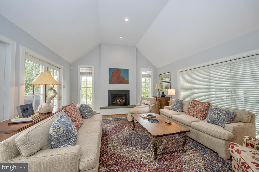 1201 Denbigh Lane Wayne, PA 19087 - Photo 20 of 54 a living room with furniture fireplace and a large window