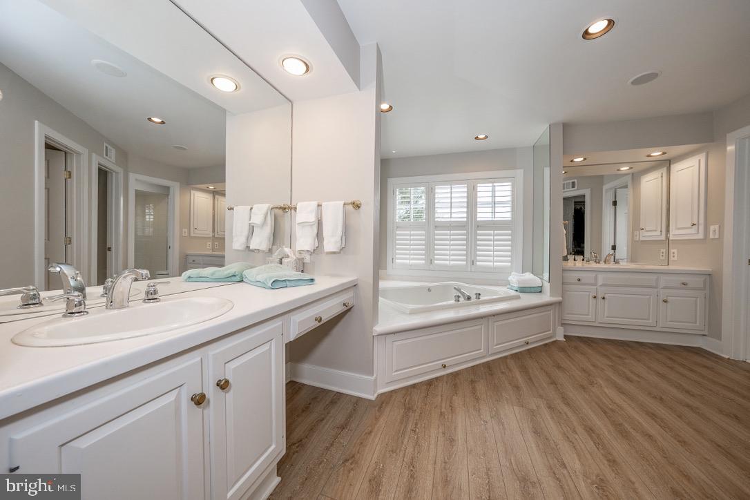 1201 Denbigh Lane Wayne, PA 19087 - Photo 32 of 54 a bathroom with a granite countertop sink mirror and bathtub