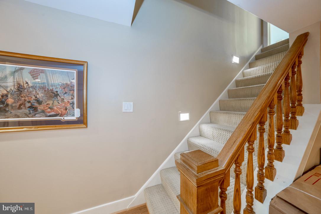 1201 Denbigh Lane Wayne, PA 19087 - Photo 39 of 54 a view of staircase with wooden floor and white walls
