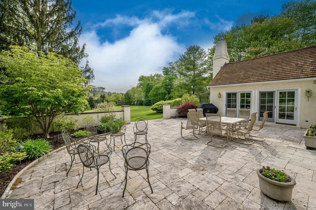 1201 Denbigh Lane Wayne, PA 19087 - Photo 47 of 54 a view of a house with backyard sitting area and garden