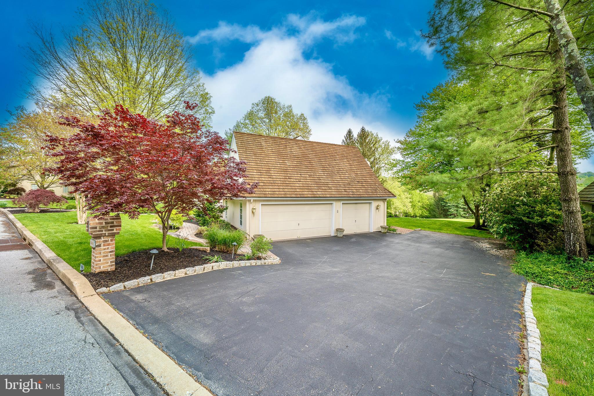 1201 Denbigh Lane Wayne, PA 19087 - Photo 53 of 54 a view of a house with a yard and potted plants