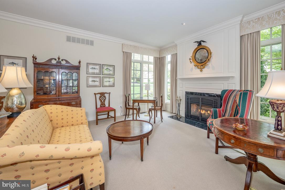 1201 Denbigh Lane Wayne, PA 19087 - Photo 6 of 54 a living room with fireplace furniture and a flat screen tv