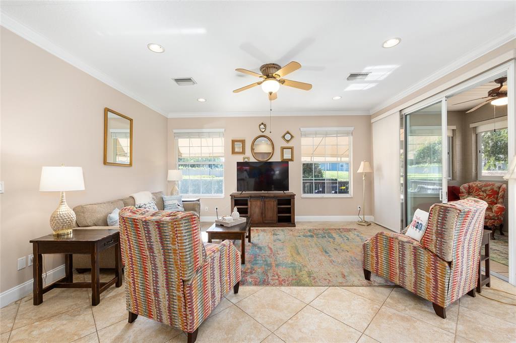 3304 Southwest 38th Street Ocala, FL 34474 - Photo 13 of 21 a living room with furniture and a flat screen tv
