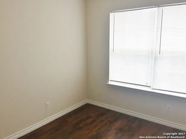 a view of a window in an empty room