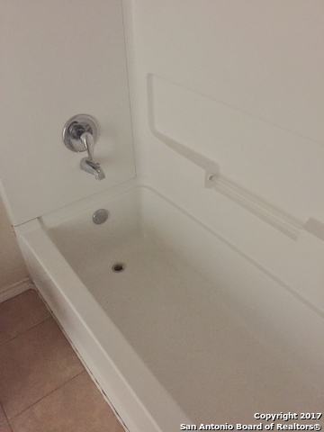 10003 Vasso View, Unit 2 Converse, TX 78109 - Photo 13 of 16 a bathroom with a bathtub