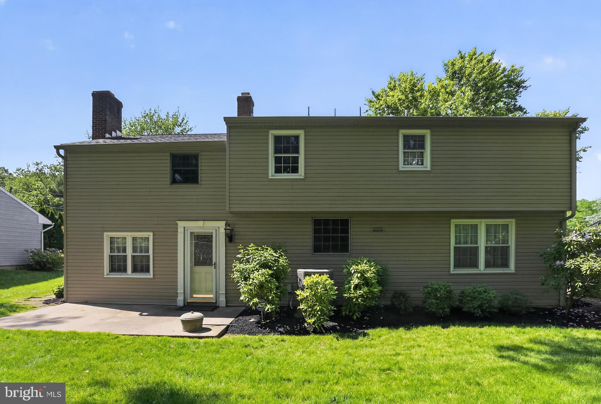 549 Covered Bridge Road Cherry Hill, NJ 08034 - Photo 10 of 16 a front view of a house with a yard and potted plants