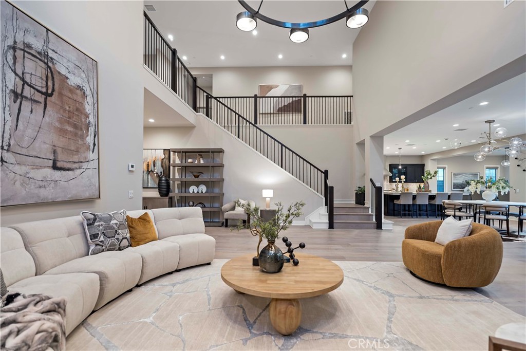115 Interstellar Irvine, CA 92618 - Photo 17 of 36 a living room with furniture and a wooden floor
