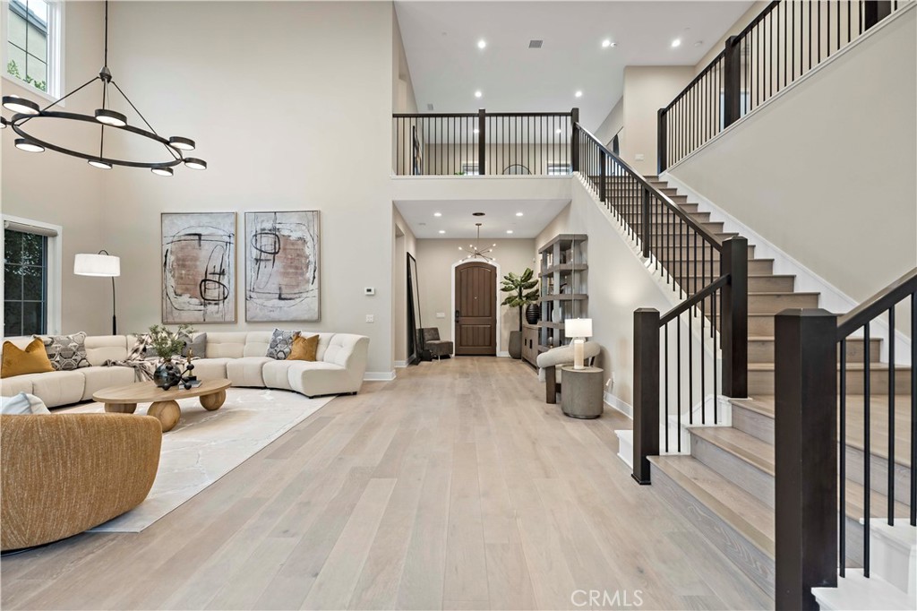 115 Interstellar Irvine, CA 92618 - Photo 19 of 36 a living room with furniture and a chandelier