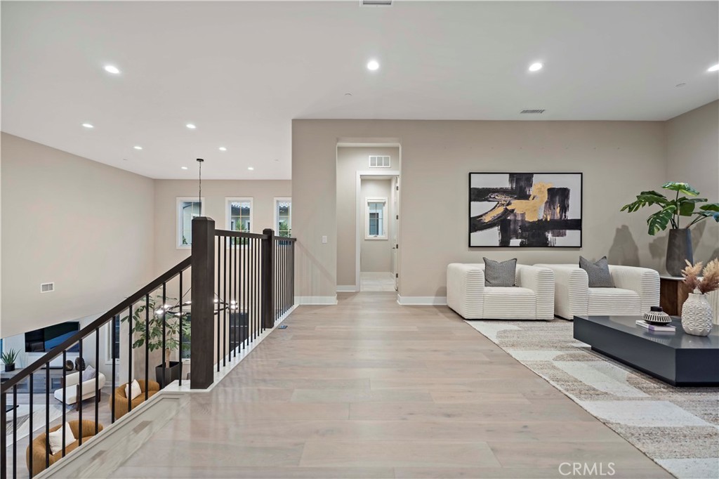 115 Interstellar Irvine, CA 92618 - Photo 20 of 36 a living room with furniture and a flat screen tv