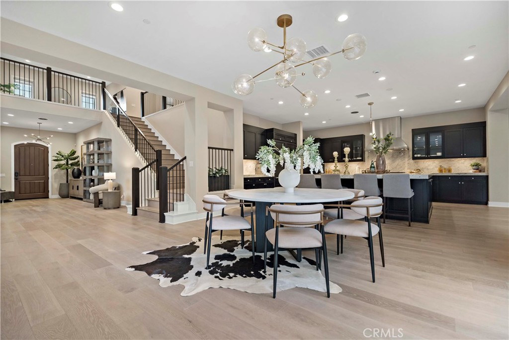 115 Interstellar Irvine, CA 92618 - Photo 7 of 36 a living room with lots of furniture and kitchen view