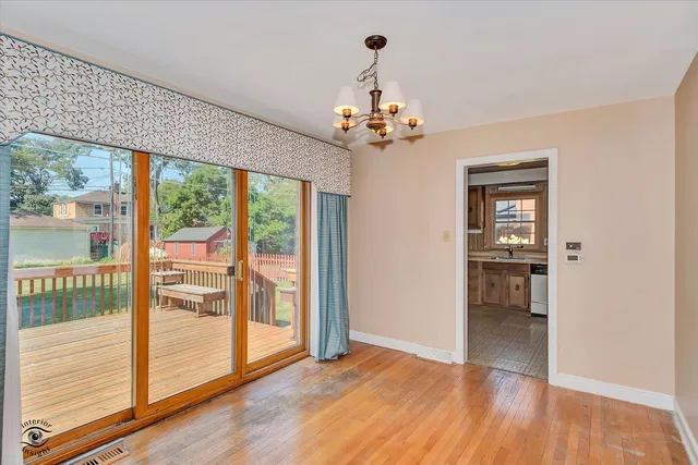 a view of an empty room with glass door