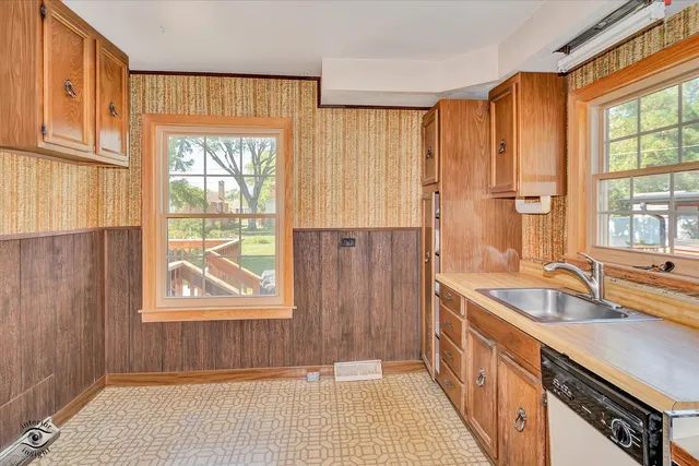 a bathroom with a sink a mirror and a shower