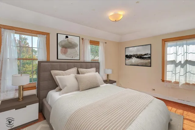 a bedroom with a large bed and a window