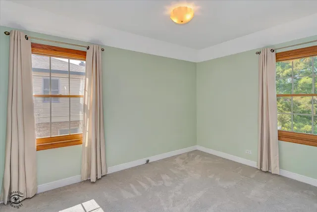 a bathroom with a sink mirror and toilet